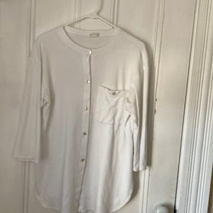 White button shirt. Can be worn alone or open on top of another shirt